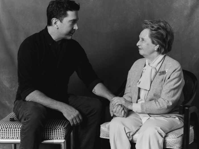 man and woman sitting on chairs